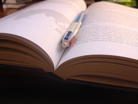 pen in center of open book