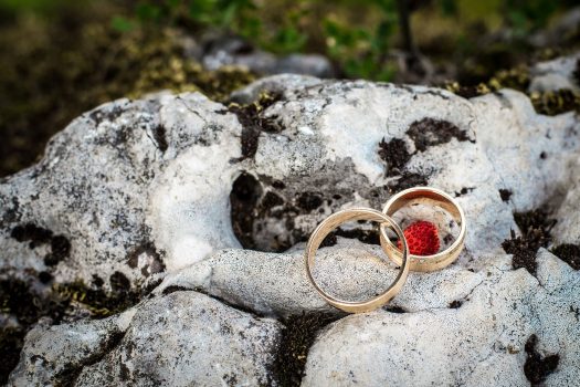 Picture of two wedding rings on a rock