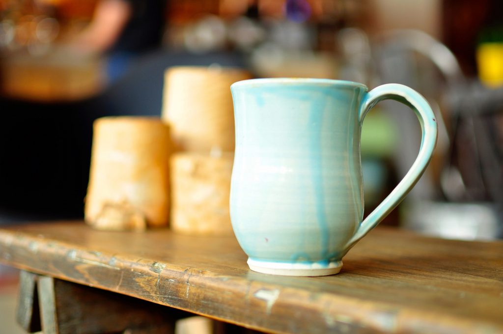 ceramic cup on wooden table