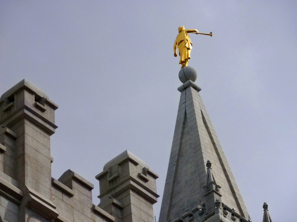 angel moroni on the top of a temple