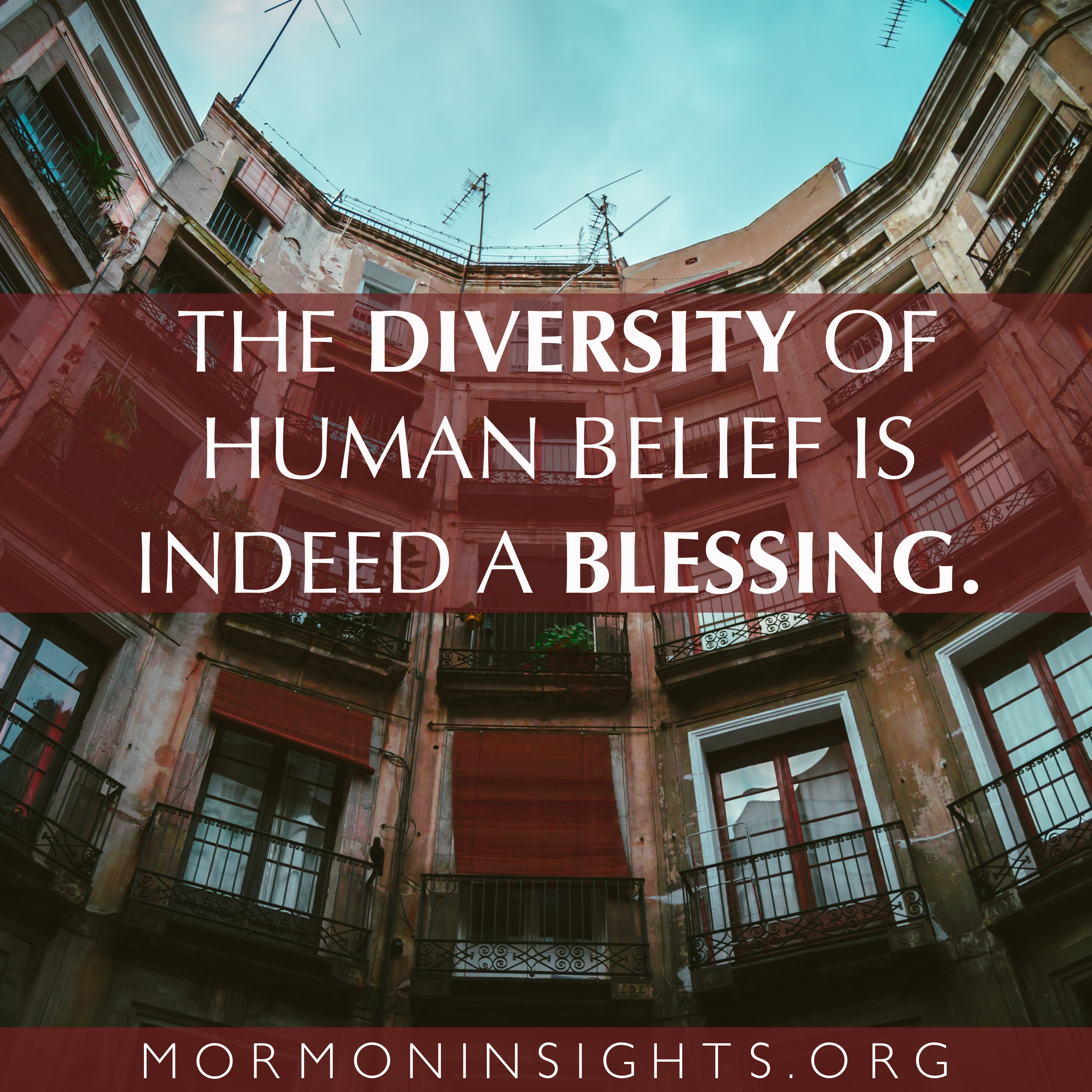 "The diversity of human belief is indeed a blessing." Quote is on a background of windows of an old apartment building
