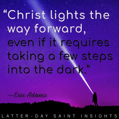 A person standing beneath a purple starry sky and pointing a bright flashlight into the air, making a white beam across the sky with a quote by Eric Adams that says, "Christ lights the way forward, even if it requires taking a few steps into the dark."
