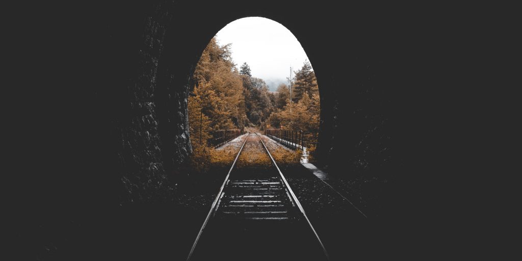 Tunnel over railroad tracks in the fall.