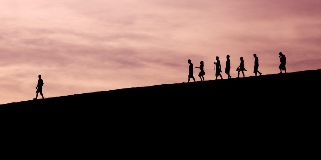 Silhouette of people on hill photo.