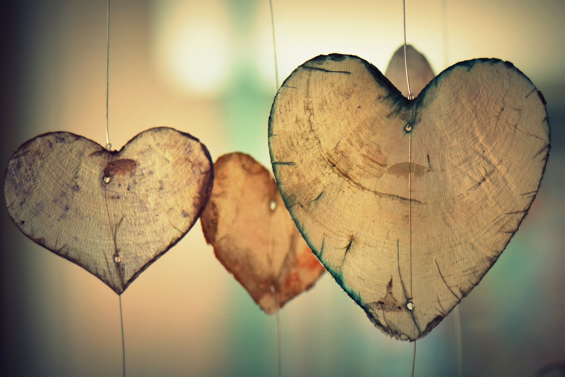 three hanging wooden hearts