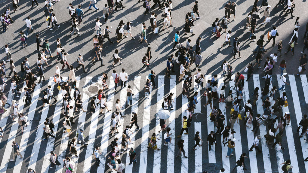 A busy intersection with people walking